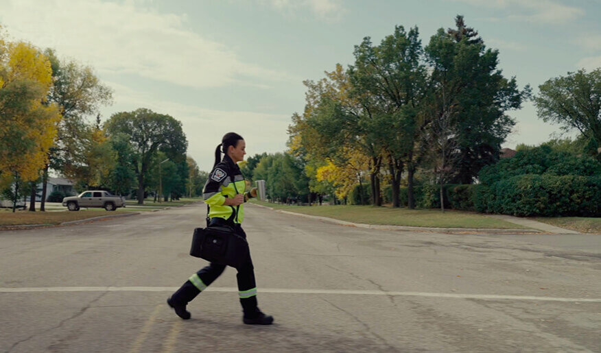 Danielle in her paramedic uniform walking to work.